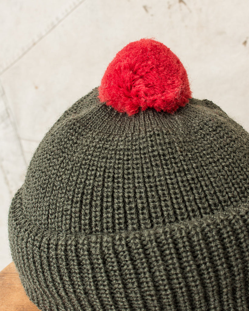 Red wool bobble store hat