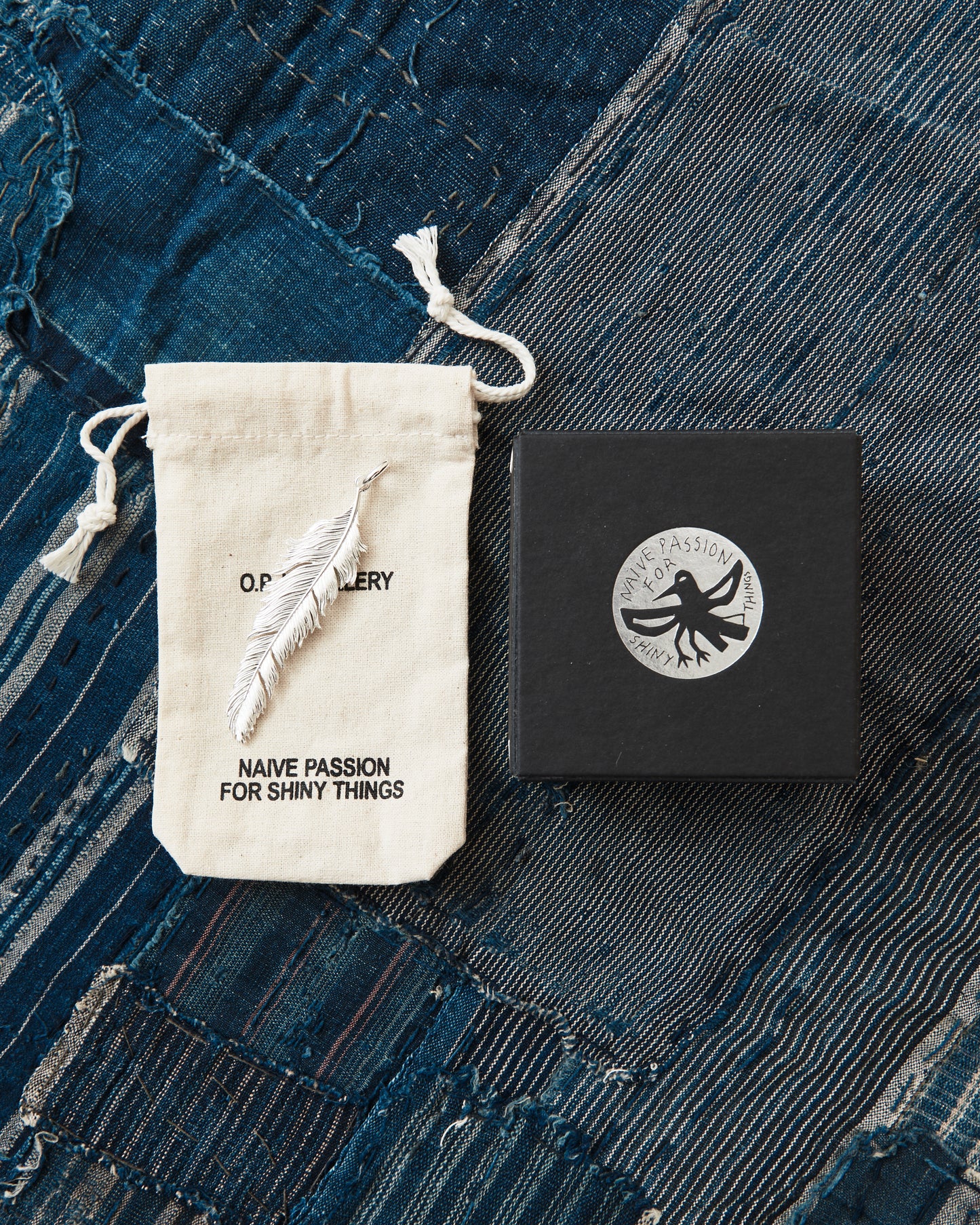 O.P Jewellery Skata Skata Big Feather