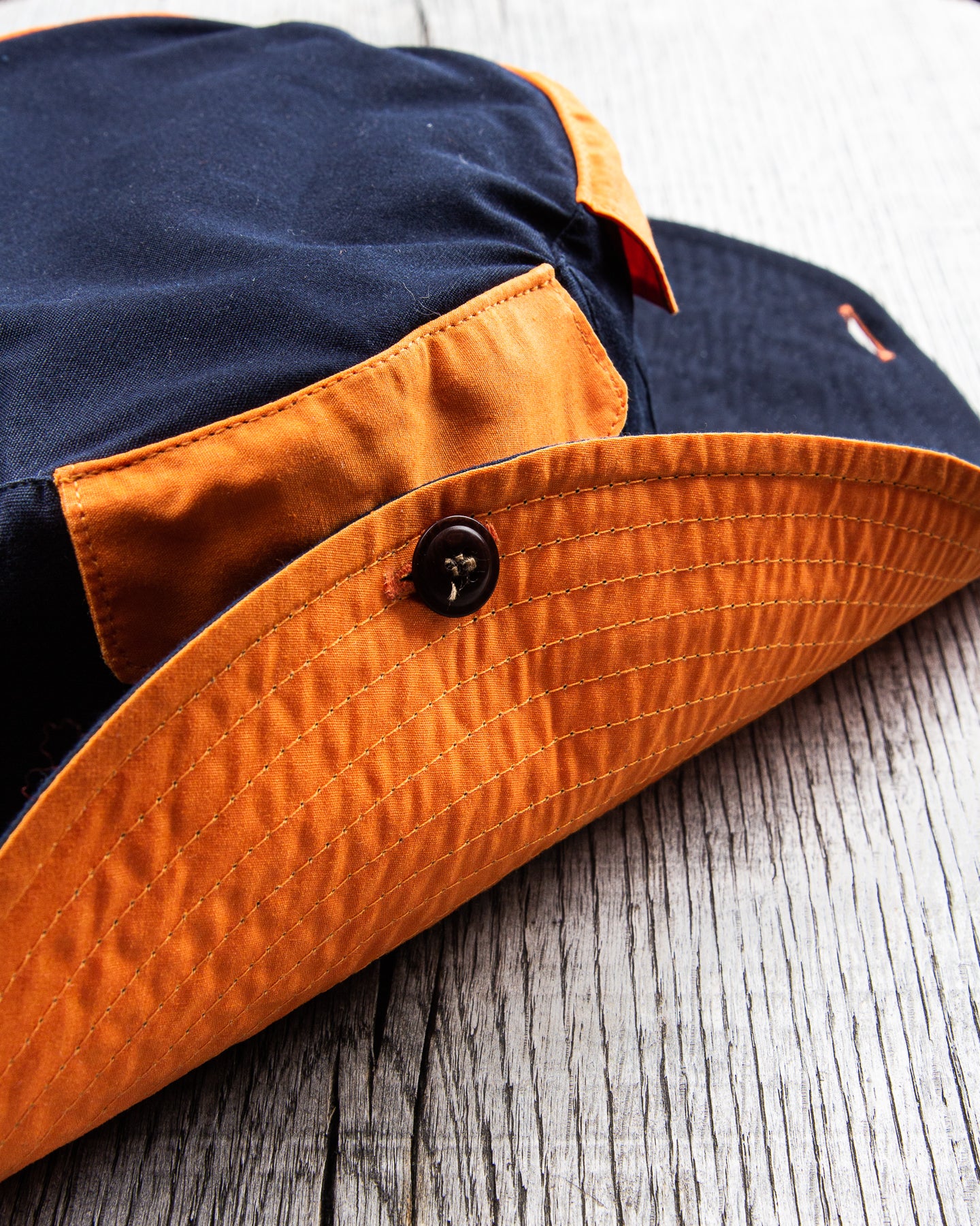 Indigofera x Second Sunrise Tur Pocket Hat Navy / Orange