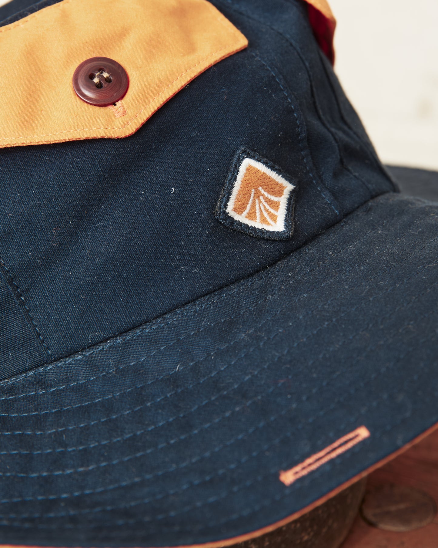 Indigofera x Second Sunrise Tur Pocket Hat Navy / Orange